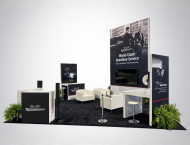 Exhibit booth design with large graphic panels and white lounge seating