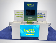 GATE exhibit booth design with a large video screen